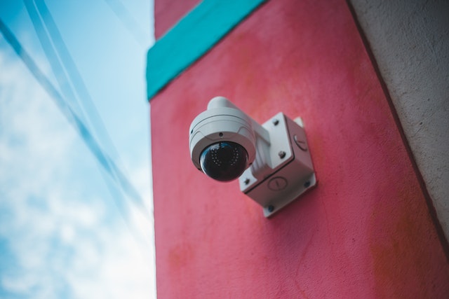 security%20camera%20on%20pink%20and%20blue%20outdoor%20wall security%20camera%20on%20pink%20and%20blue%20outdoor%20wall